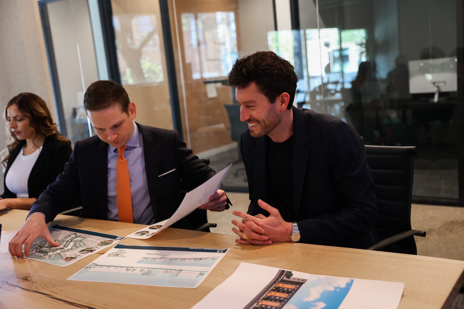 Partners reviewing project materials